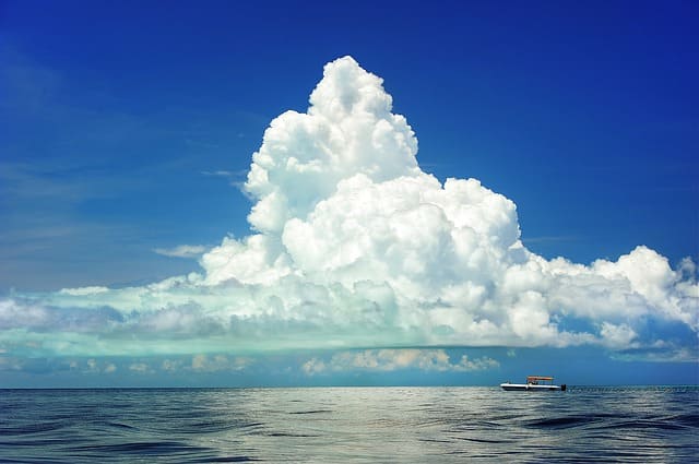Clouds over the sea, with boat.