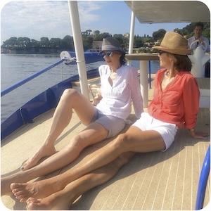 Couple sunbathing on the boat deck