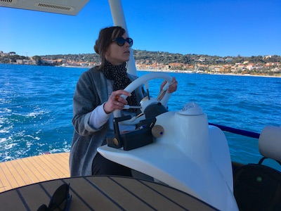 Louise at the helm of a solar-powered electric boat